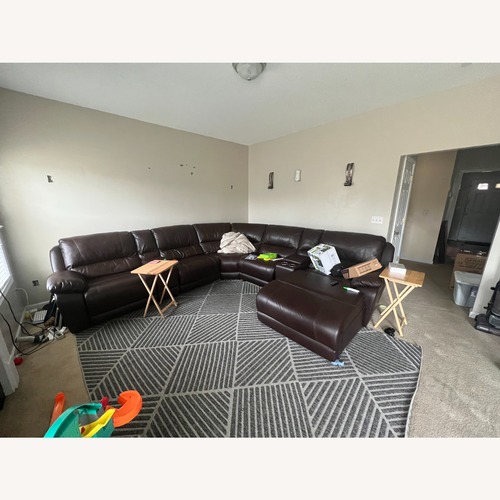 Used Rooms To Go  Dark Brown 3+ Piece Sectional for sale on AptDeco
