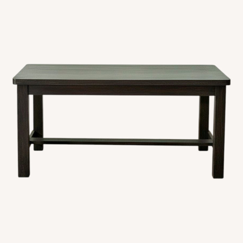 Used Dark Brown Wood Dining Table for sale on AptDeco