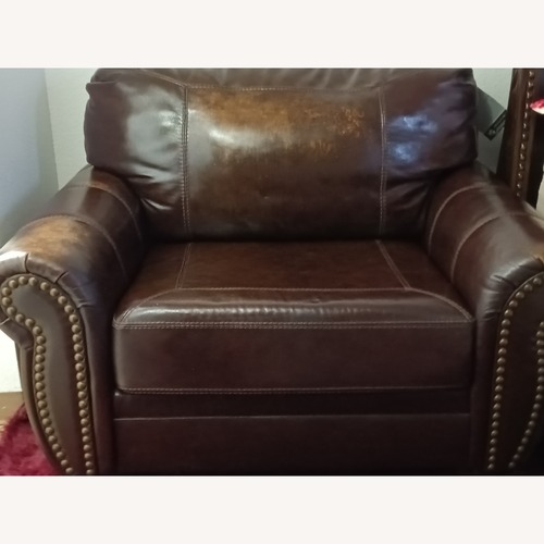 Used Signature Design by Ashley Brown Leather Armchair for sale on AptDeco