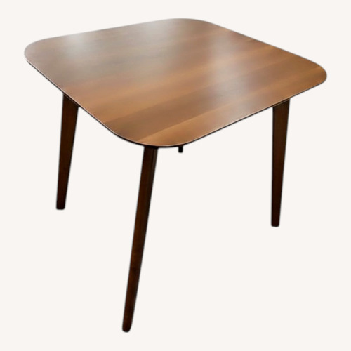 Used Dark Brown Wood Dining Table for sale on AptDeco