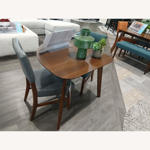 Used Dark Brown Wood Dining Table for sale on AptDeco