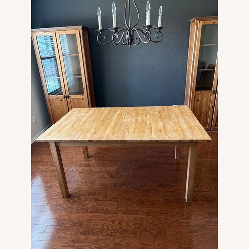 Used IKEA Natural Wood Dining Table for sale on AptDeco