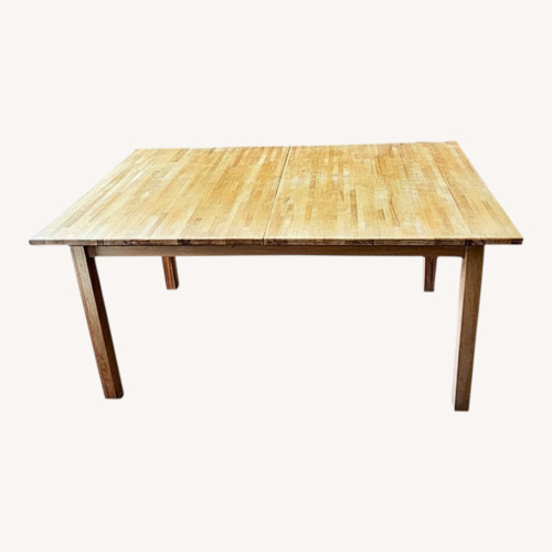 Used IKEA Natural Wood Dining Table for sale on AptDeco