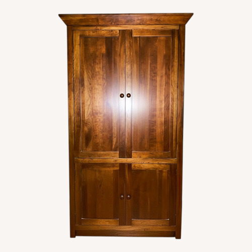 Used Ethan Allen Dark Brown Wood Armoire for sale on AptDeco