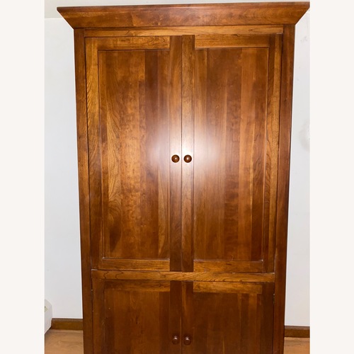 Used Ethan Allen Dark Brown Wood Armoire for sale on AptDeco