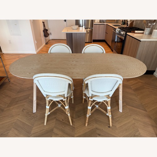 Used Interior Define Oval Wooden Dining Table for sale on AptDeco