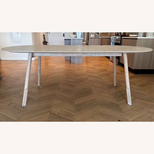 Used Interior Define Oval Wooden Dining Table for sale on AptDeco