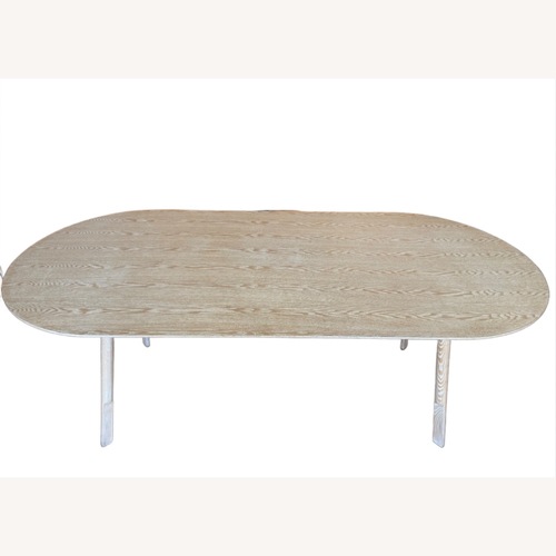 Used Interior Define Oval Wooden Dining Table for sale on AptDeco