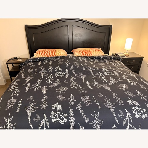 Used Raymour & Flanigan Black Wood King Bed for sale on AptDeco