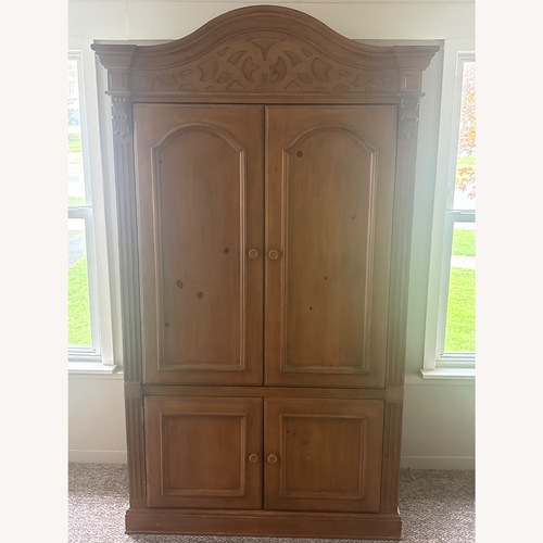 Used Light Brown Wood Armoire for sale on AptDeco