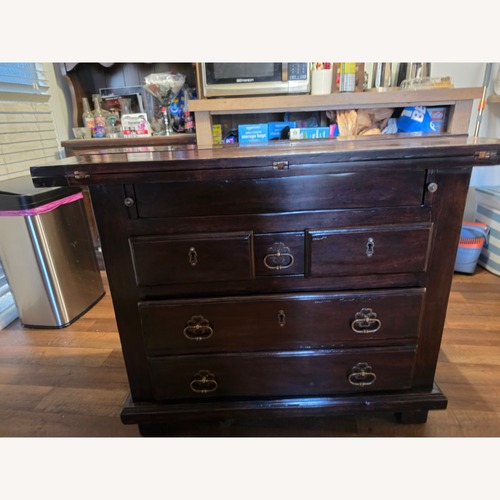 Used Vintage/Antique Dark Brown Wood Dresser for sale on AptDeco