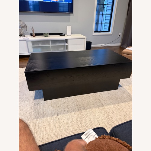 Used Black Wood Coffee Table for sale on AptDeco