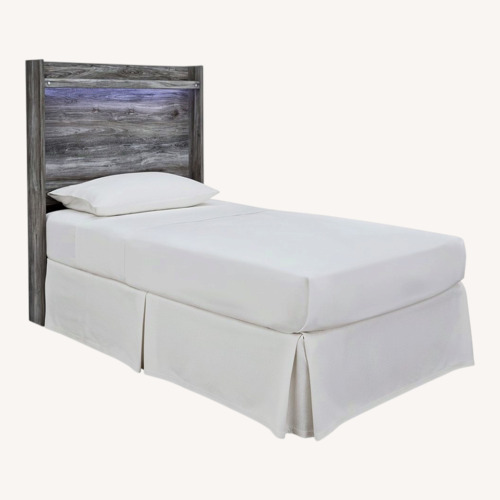 Used Ashley Furniture Baystorm Light Gray Wood Twin Bed for sale on AptDeco