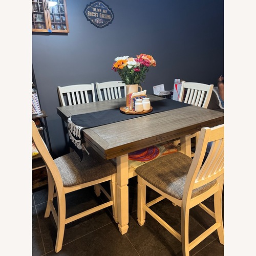 Used Brown and White Dining Table With 8 Chairs for sale on AptDeco
