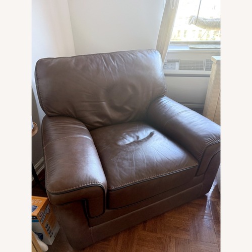 Used Raymour & Flanigan Colton Leather Swivel Chair for sale on AptDeco