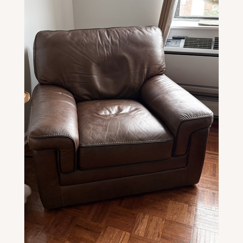 Used Raymour & Flanigan Colton Leather Swivel Chair for sale on AptDeco