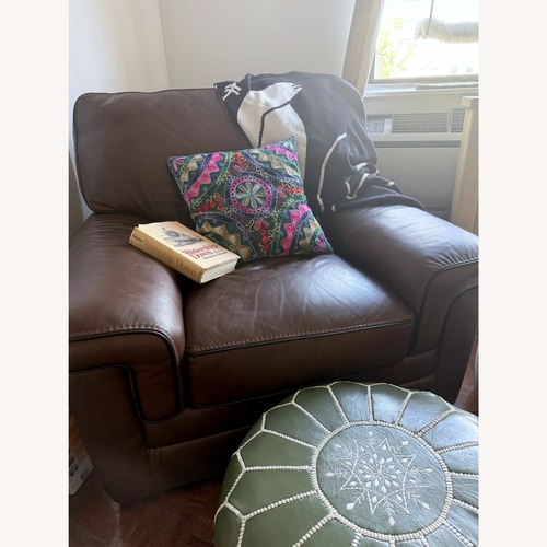 Used Raymour & Flanigan Colton Leather Swivel Chair for sale on AptDeco