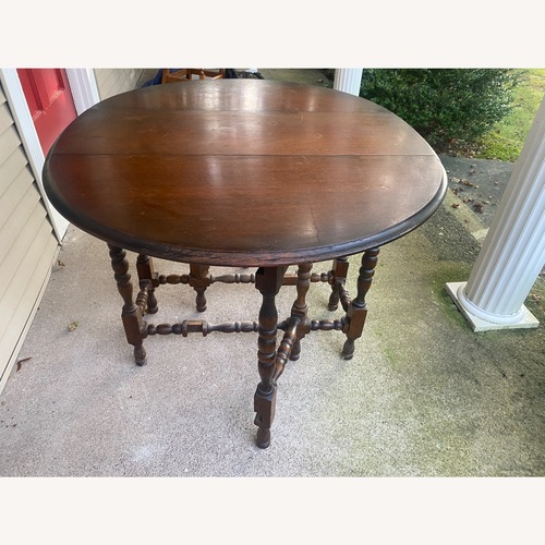 Used Light Brown Wood Dining Table for sale on AptDeco