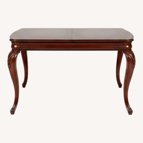 Used Legacy Classic Extendable Wood Dining Table Seats Six for sale on AptDeco