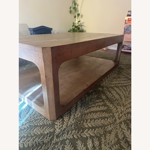Used Living Spaces Light Brown Wood Coffee Table for sale on AptDeco