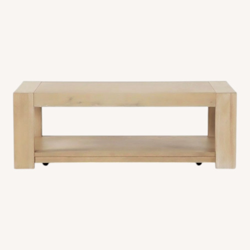 Used Living Spaces Light Brown Wood Coffee Table for sale on AptDeco