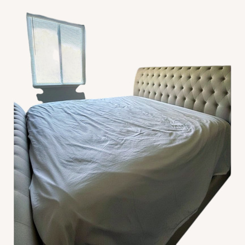 Used Raymour & Flanigan White Fabric King Bed for sale on AptDeco