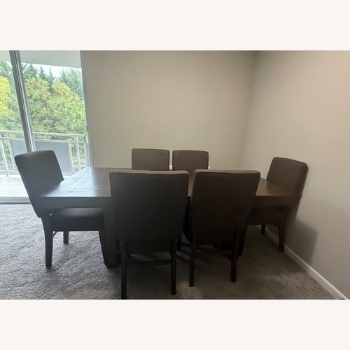 Used Raymour & Flanigan Light Brown Dining Table for sale on AptDeco