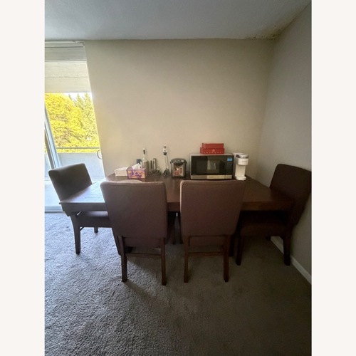 Used Raymour & Flanigan Light Brown Dining Table for sale on AptDeco