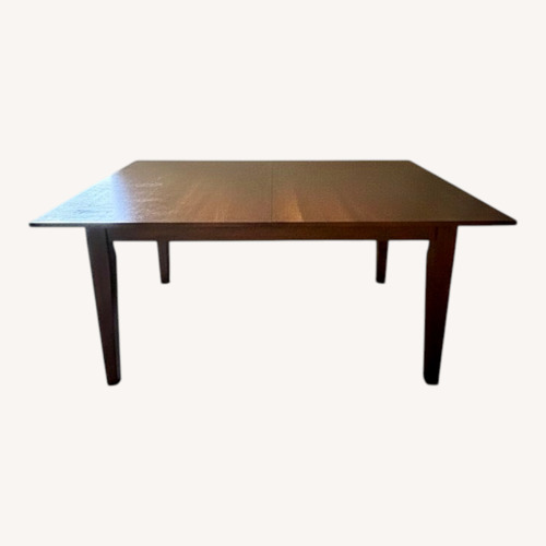 Used Raymour & Flanigan Light Brown Dining Table for sale on AptDeco