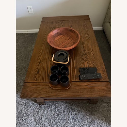 Used Raymour & Flanigan Dark Brown Wood Coffee Table for sale on AptDeco