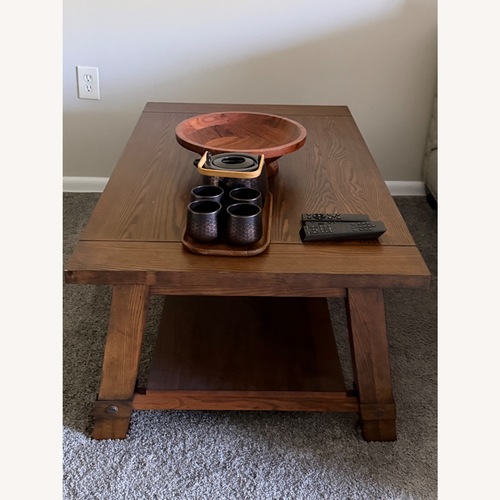 Used Raymour & Flanigan Dark Brown Wood Coffee Table for sale on AptDeco