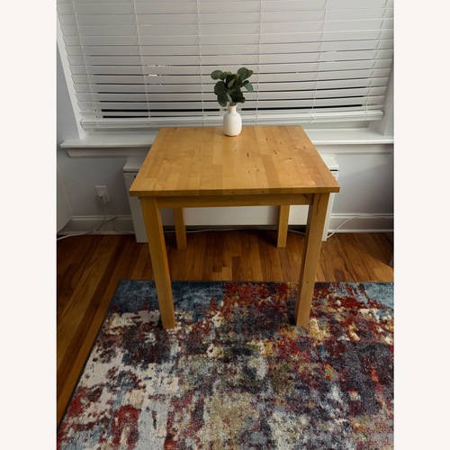 Used Natural Wood Dining Table for sale on AptDeco