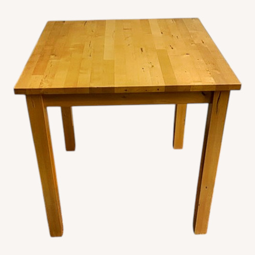 Used Natural Wood Dining Table for sale on AptDeco