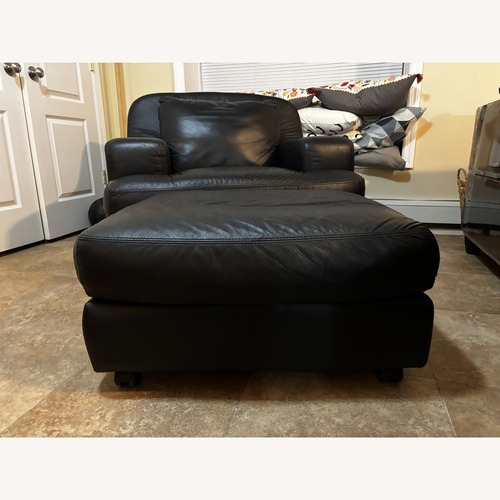 Used Black Leather Armchair with Ottoman for sale on AptDeco