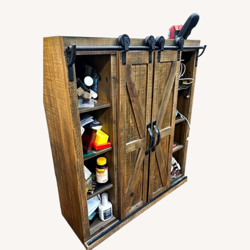 Used Sliding Barn-Door Cabinet Dark Wood for sale on AptDeco