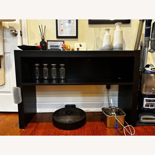 Used Black Console Table with Glass Top for sale on AptDeco