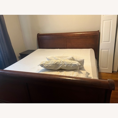 Used Wood King Bed for sale on AptDeco