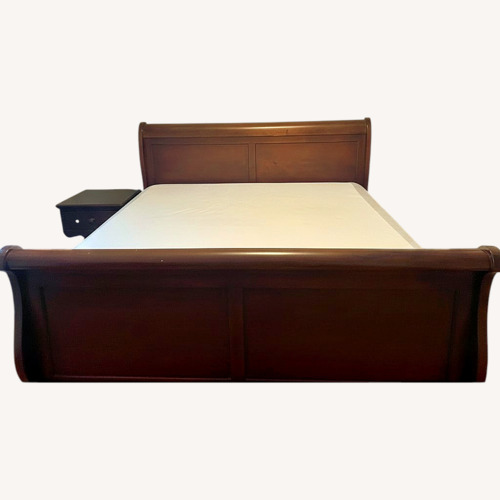Used Wood King Bed for sale on AptDeco