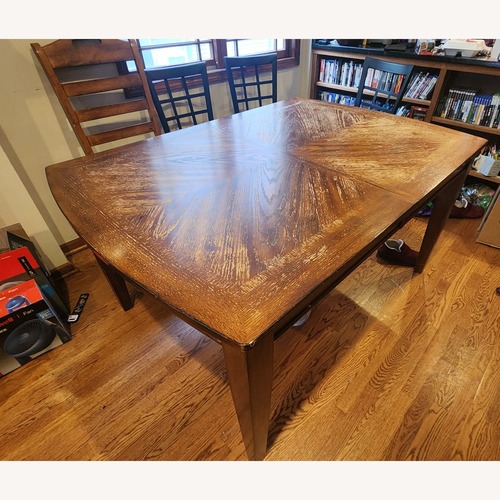 Used Dark Brown Wood Dining Table for sale on AptDeco