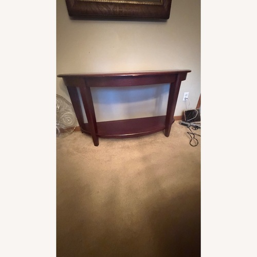 Used Dark Brown Wood Coffee Table for sale on AptDeco