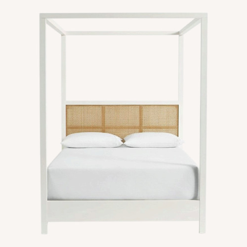 Used Pottery Barn White Westly Cane Canopy Bed for sale on AptDeco
