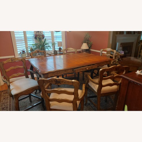 Used Light Brown Wood Dining Set for sale on AptDeco