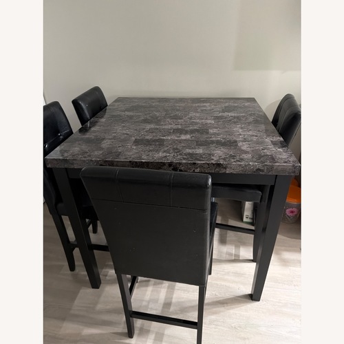 Used Dark Brown Wood Dining Set for sale on AptDeco