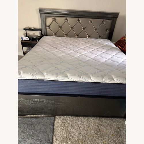 Used Dark Brown Wood King Bed for sale on AptDeco