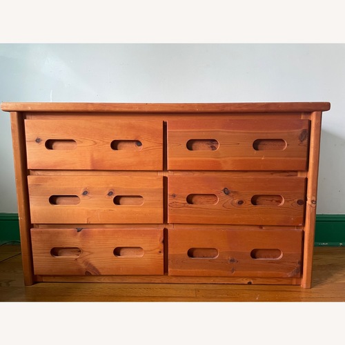 Used Six Drawer Light Brown Wood Dresser for sale on AptDeco