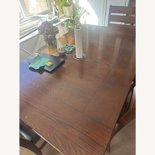 Used Hardwood Dinning table with chairs for sale on AptDeco