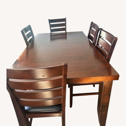 Used Hardwood Dinning table with chairs for sale on AptDeco