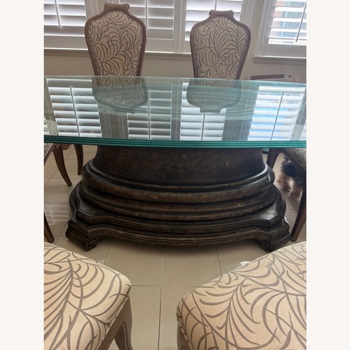 Used Dark Brown Glass Dining Table for sale on AptDeco