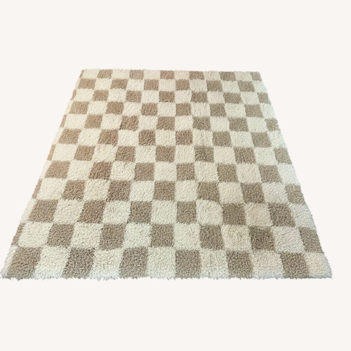 Used Atira Light Brown and Cream Checkered Rug for sale on AptDeco