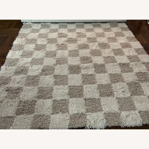 Used Atira Light Brown and Cream Checkered Rug for sale on AptDeco
